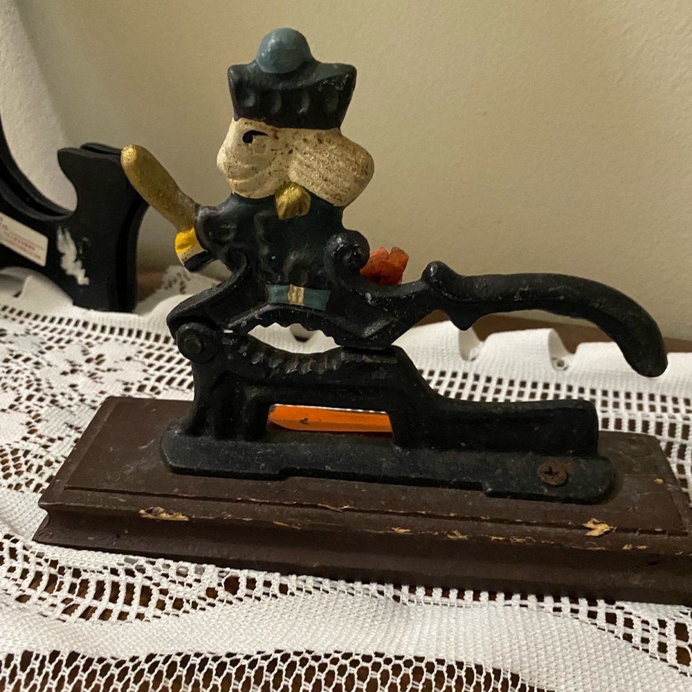 Black Cast Iron Nutcracker Figurine with Orange Accent